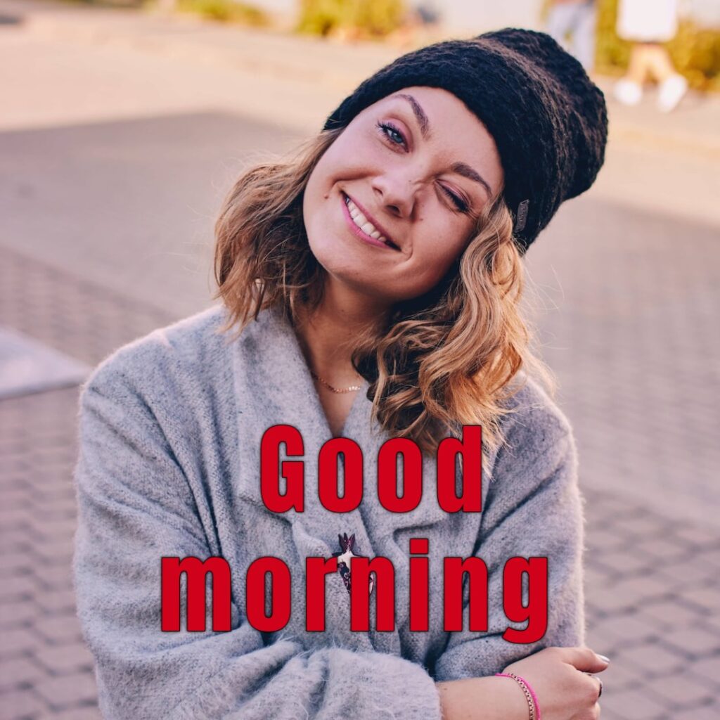 A funny girl in winter having cap and sweeter looking like a funny good morning image