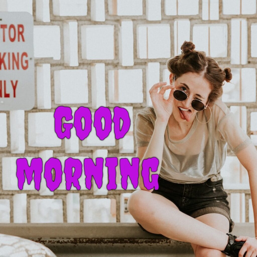 A beautiful funny girl having sunglasses and half jeans and t shirt looking like a funny girl good morning image