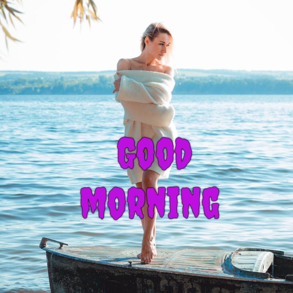 A beautiful funny girl standing on the boat in water having sweeter looking like a funny good morning image
