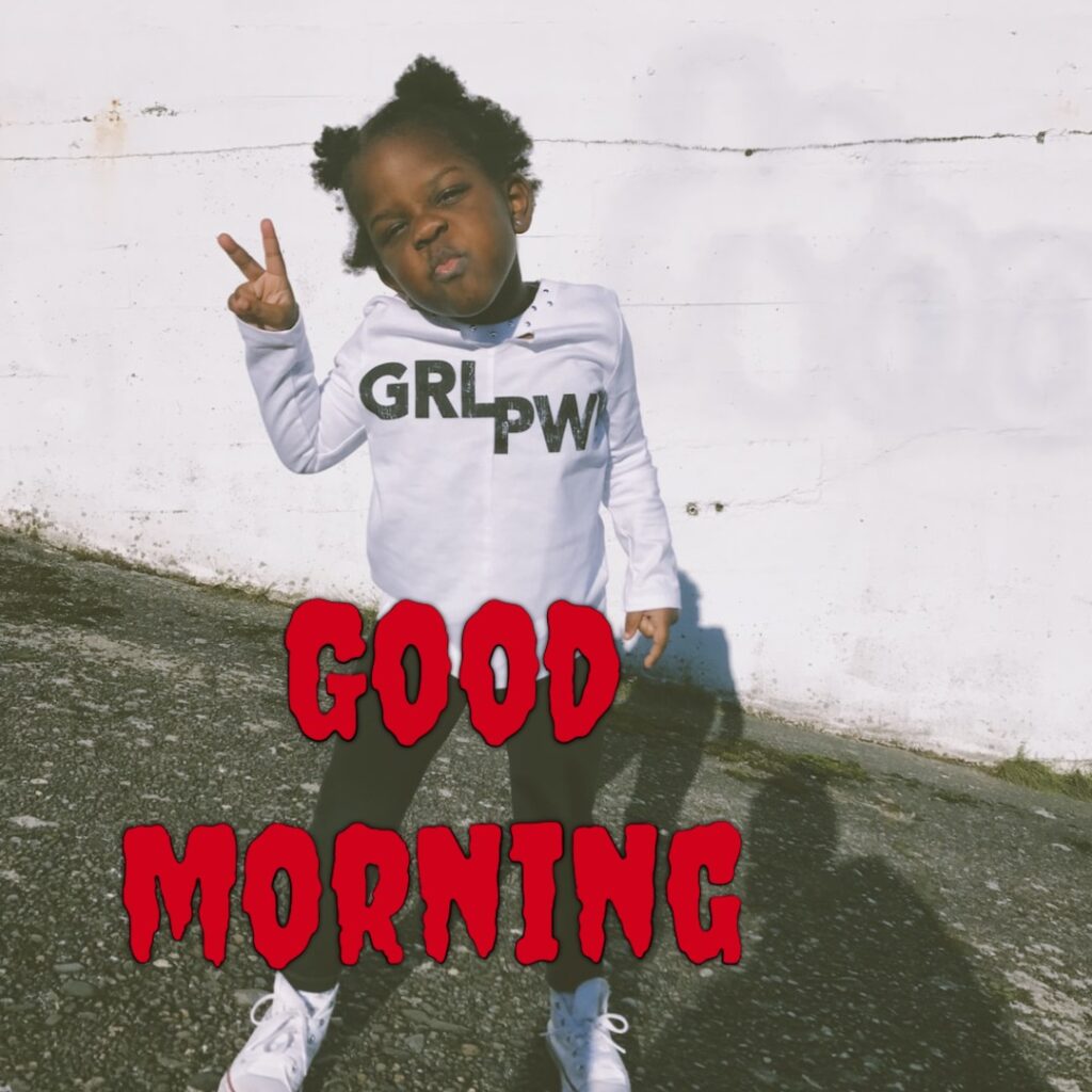 A cute girl having full t shirt looking like a funny good morning image
