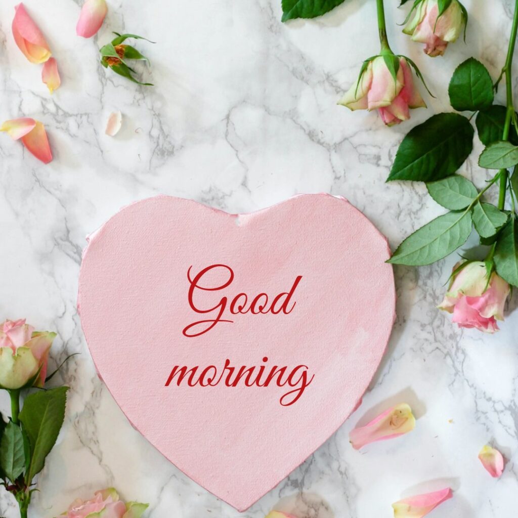 A beautiful pink colour heart sourrounded by flower looking like a lovely good morning images
